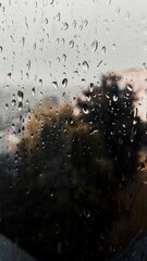 rain drops on window with dark background