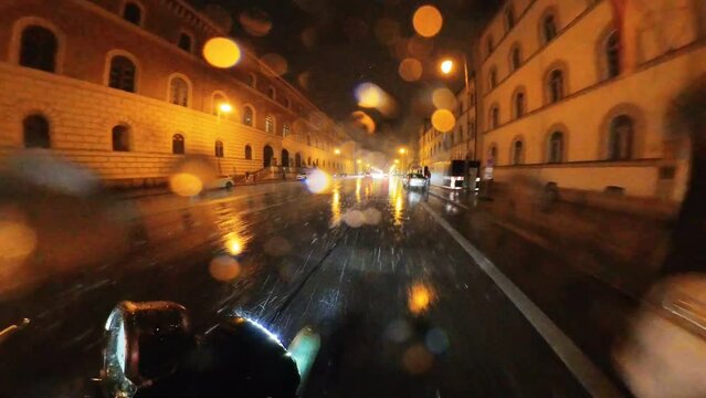 Night riding naked motorcycle bike during rain through the Munich city centre, Germany &ndash; 360 degree effect &ndash; video and audio