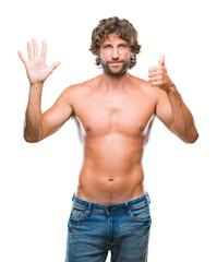 Fototapeta premium Handsome hispanic model man sexy and shirtless over isolated background showing and pointing up with fingers number six while smiling confident and happy.