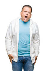 Middle age arab man wearing sweatshirt over isolated background In shock face, looking skeptical and sarcastic, surprised with open mouth