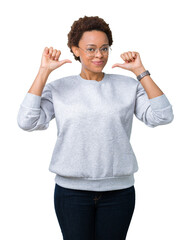Young beautiful african american woman wearing glasses over isolated background looking confident...