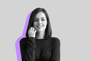 Portrait of happy young woman on grey background