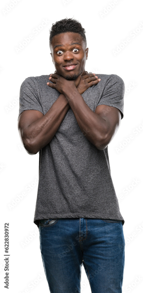 Poster young african american man wearing grey t-shirt shouting and suffocate because painful strangle. hea