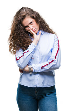 Beautiful brunette curly hair young girl wearing elgant look over isolated background thinking looking tired and bored with depression problems with crossed arms.