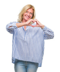 Middle age blonde business woman over isolated background smiling in love showing heart symbol and shape with hands. Romantic concept.