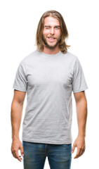 Young handsome man with long hair over isolated background winking looking at the camera with sexy expression, cheerful and happy face.