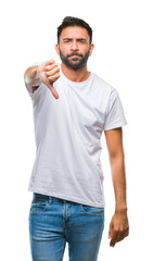 Adult hispanic man over isolated background looking unhappy and angry showing rejection and negative with thumbs down gesture. Bad expression.