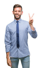 Young handsome business man over isolated background smiling with happy face winking at the camera doing victory sign. Number two.