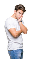 Young handsome man wearing white t-shirt over isolated background thinking looking tired and bored with depression problems with crossed arms.