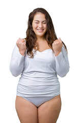 Beautiful plus size young overwight woman wearing white underwear over isolated background excited...