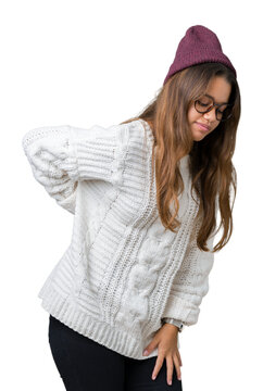 Young beautiful brunette hipster woman wearing glasses and winter hat over isolated background Suffering of backache, touching back with hand, muscular pain