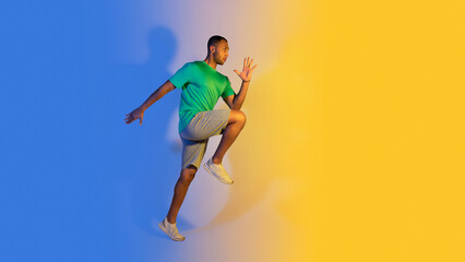 Sporty african athlete man running over blue and yellow background