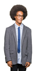 Young african american business man with afro hair wearing glasses looking away to side with smile on face, natural expression. Laughing confident.