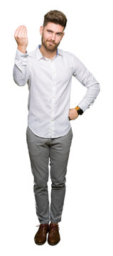 Young handsome business man Doing Italian gesture with hand and fingers confident expression