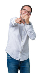 Handsome middle age elegant senior business man wearing glasses over isolated background Laughing of you, pointing to the camera with finger hand over mouth, shame expression