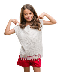Brunette hispanic girl looking confident with smile on face, pointing oneself with fingers proud...