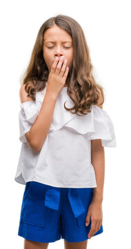 Brunette hispanic girl bored yawning tired covering mouth with hand. Restless and sleepiness.