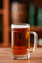 Mug of beer on table in bar. Oktoberfest celebration