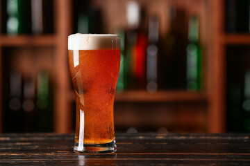 Glass of beer on table in bar. Oktoberfest celebration