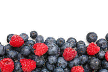 Ripe raspberry and blueberry on white background, closeup