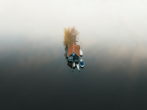 Aerial view of an house on the water in Scheendijk, Netherlands.