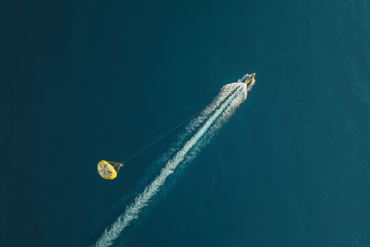 Aerial view of a parachute above the sea, Sicily, Italy.