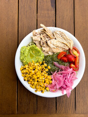Closeup of colorful healthy delicious meal of chicken with fresh vegetables