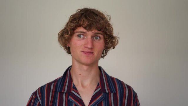 embarrassed man curly 