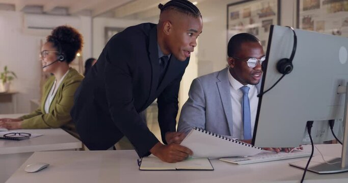 Computer, coaching mentor and business people in call center for customer service, support or sales at night in office. Leadership, training or happy black men help telemarketing intern with document