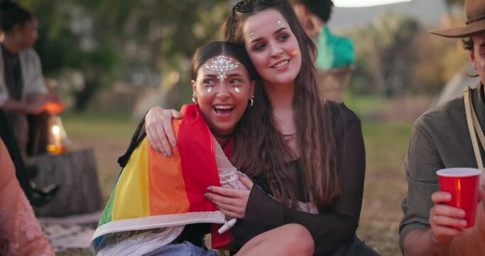 Pride, festival and friends happy at a party or outdoor gathering as lgbtq community at a queer social event together. Non binary, excited and young people at a parade for gay and lesbian freedom