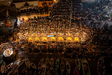 Aerial view of people along the Ganges river at night in Mughalsarai, Uttar Pradesh, India.