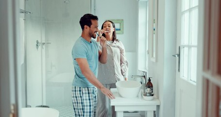 Dance, happy and a couple brushing teeth in a bathroom for healthcare, cleaning and grooming. Morning, excited and a playful man and woman doing dental hygiene together while dancing in a house