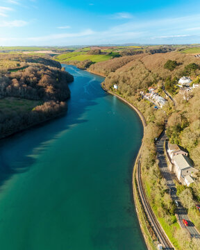 Aerial view of Looe River along side the railway line and countryside, Cornwall, United Kingdom.