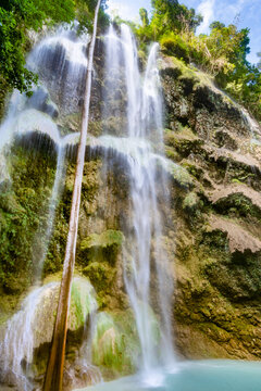 Multiple cascades of the Tumalog Water Falls, pouring into refreshing water pools below,in Oslob, Cebu,The Philippines.