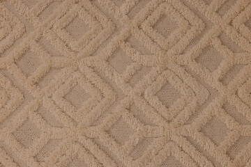Soft beige carpet with pattern as background, top view
