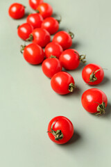 Fototapeta na wymiar Many fresh cherry tomatoes on grey background