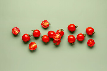 Many fresh cherry tomatoes on grey background