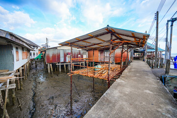 Houses on stilts in the floating fishing village of Koh Panyee, suspended over the waters of the...
