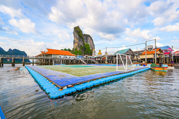 Fototapeta na wymiar Floating soccer field in the fishing village of Koh Panyee made of houses on stilts in Phang Nga Bay, Andaman Sea, Thailand