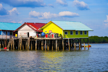 Houses on stilts in the floating fishing village of Koh Panyee, suspended over the waters of the Andaman Sea in the Phang Nga Bay, Thailand