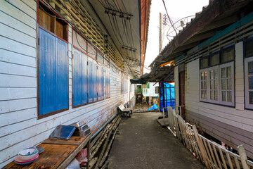 Narrow street in the floating fishing village of Koh Panyee made of houses on stilts in Phang Nga Bay, Andaman Sea, Thailand