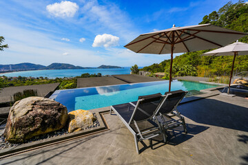 Infinity pool offering a view over the bay of Patong on Phuket island in the south of Thailand,...