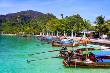 Fototapeta na wymiar Longtail boats moored on the Ton Sai beach promenade on Koh Phi Phi island in the Andaman Sea, Krabi Province, Thailand