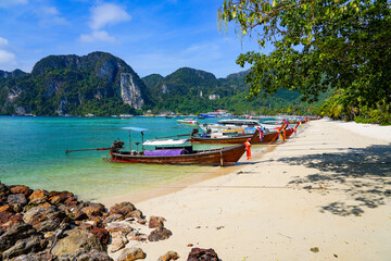 Fototapeta na wymiar Longtail boats moored on Ton Sai beach on Koh Phi Phi island in the Andaman Sea, Krabi Province, Thailand