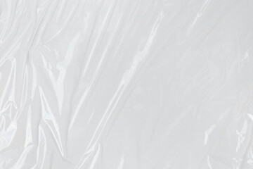 Transparant wrinkled plastic, white plastic or polyethylene bag texture, macro, white background © Background Studio