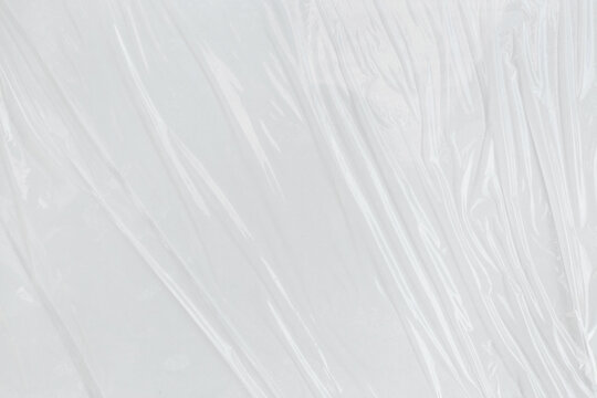 Transparant wrinkled plastic, white plastic or polyethylene bag texture, macro, white background