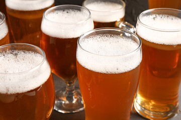 Glasses of cold beer on black background. Oktoberfest celebration