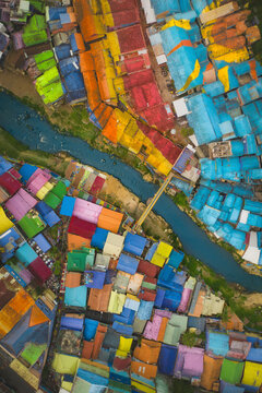 Aerial drone view of colourful houses of Kampung Tridi, Malang, Java, Indonesia.
