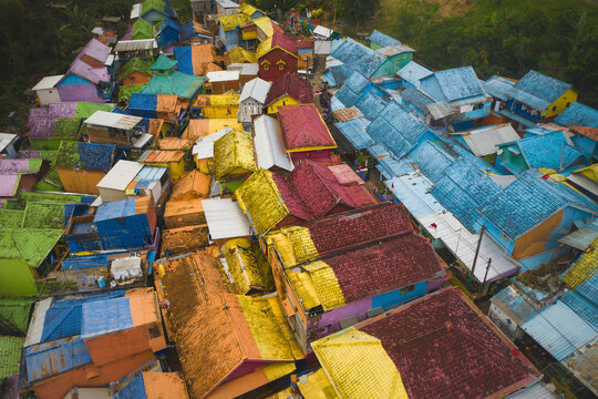 Aerial drone view of colourful houses of Kampung Tridi, Malang, Java, Indonesia.