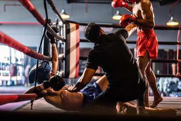 Two young professional boxer having a competition tournament on stage. 